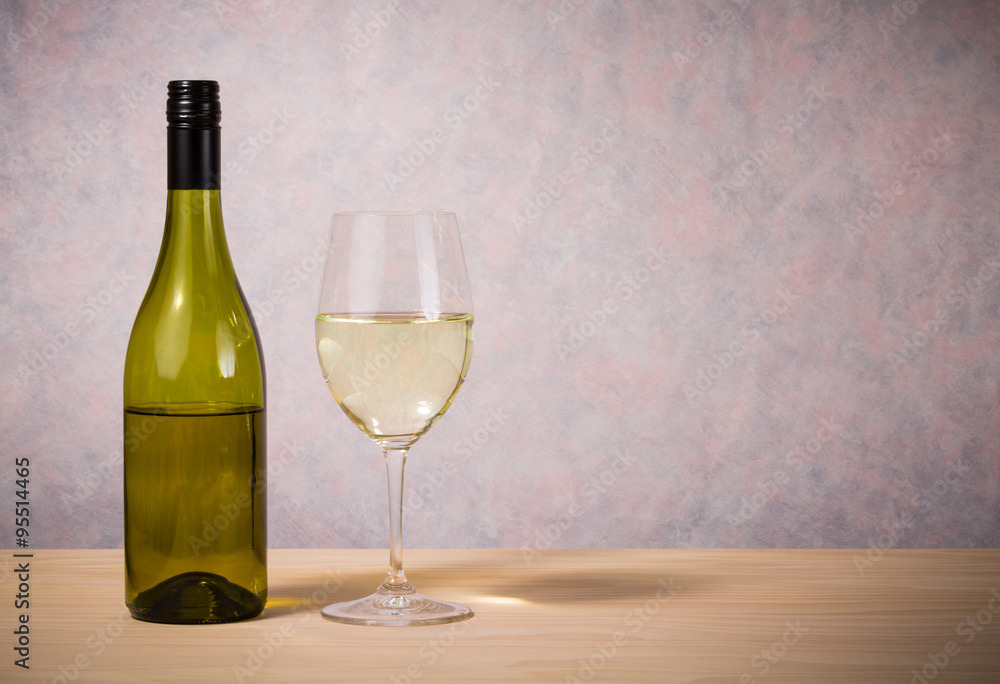 glass and bottle of white wine glass and bottle of white wine