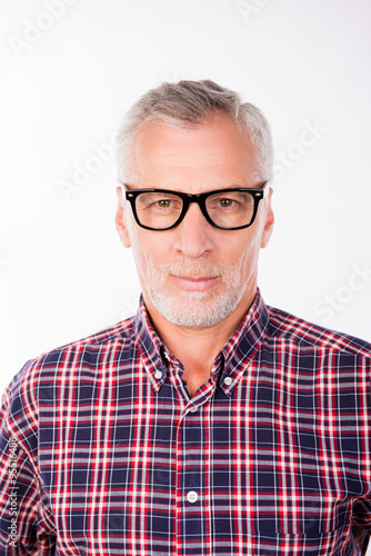 Portrait of old handsome man with glasses
