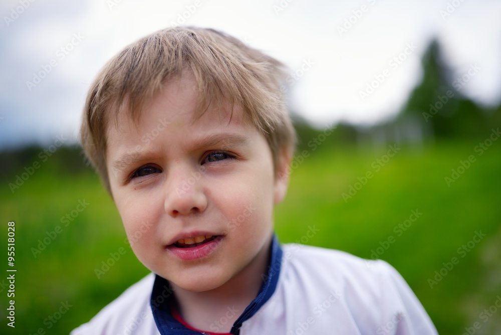 Outdoors closeup portrait of caucasian little boy Outdoors closeup portrait of caucasian little boy