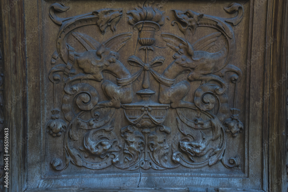 Entrance, old wooden door with carvings