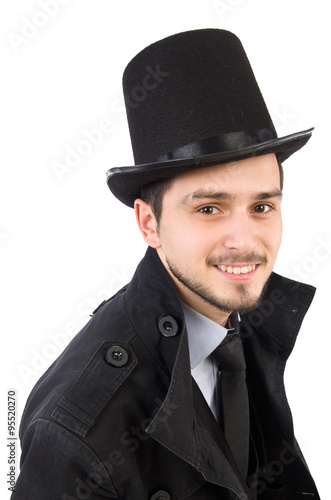 Young man in coat and hat isolated on white