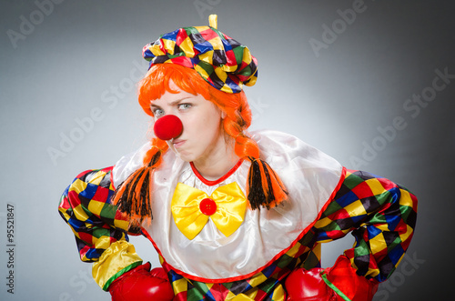 Funny clown in comical concept