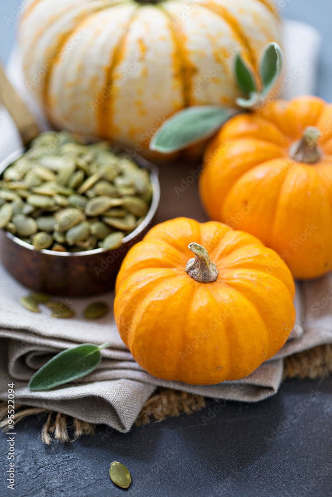 Pumpkins with seeds and sage leaves Pumpkins with seeds and sage leaves