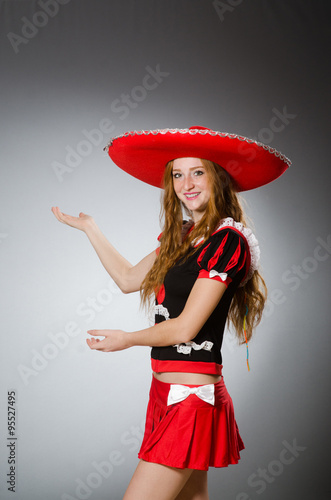 Mexican woman wearing sombrero hat