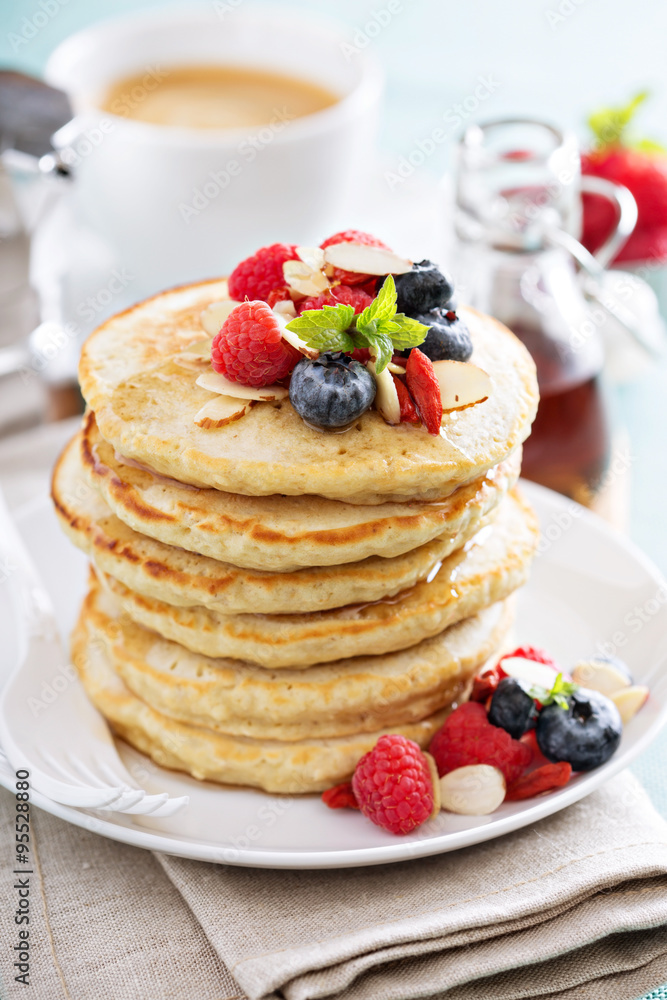 Fluffy oatmeal pancakes stack with fresh berries Fluffy oatmeal pancakes stack with fresh berries