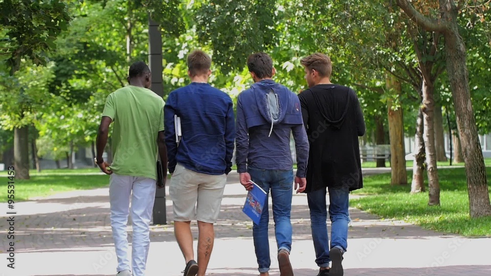 College of students walking together on campus. slow motion College of students walking together on campus. slow motion