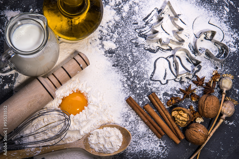 Baking ingredients for making dough on black board. Marry Christmas Baking ingredients for making dough on black board. Marry Christmas