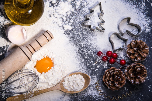 Baking ingredients for making dough on black board. Marry Christmas