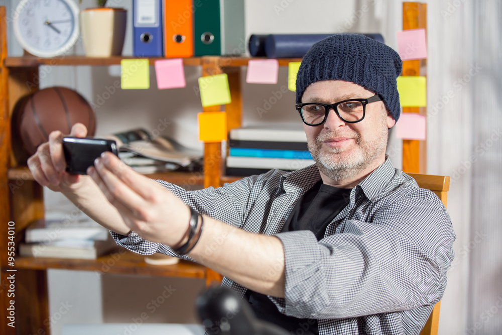 Designer working at the office. Selective focus. Small business owner Designer working at the office. Selective focus. Small business owner