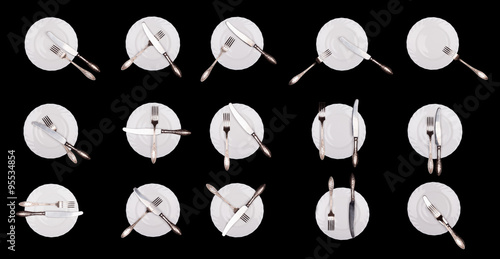 Set of etiquette signs: plate, knife, fork isolated on black