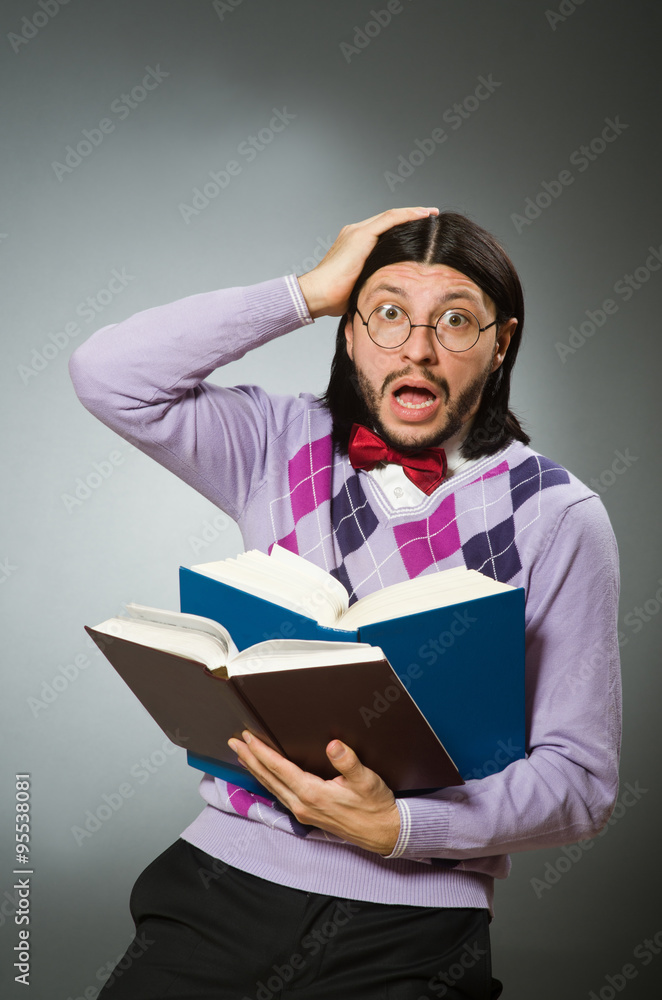 Young student with book in learning concept Young student with book in learning concept