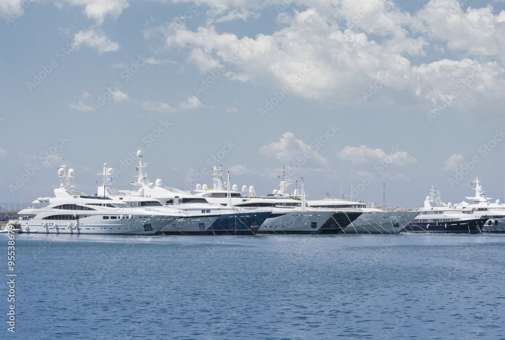Luxury yachts in marina, docked on the pier