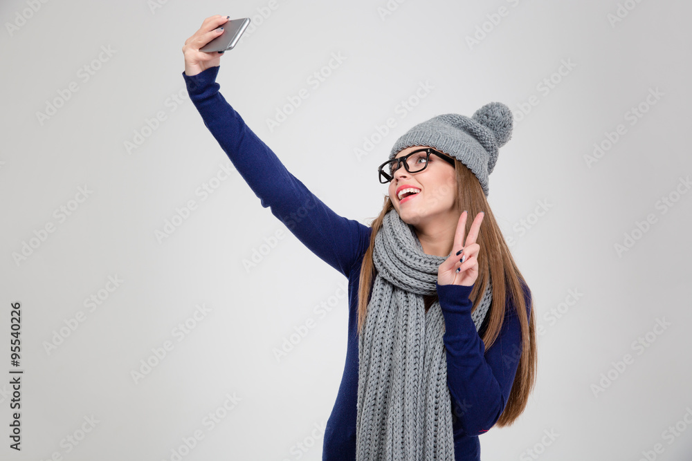 Happy woman making selfie photo on smartphone Happy woman making selfie photo on smartphone