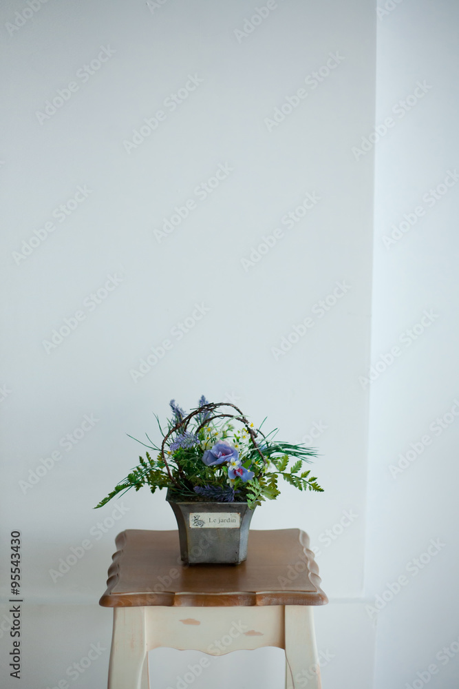 Flower pot with white wall