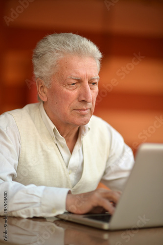 man sitting with laptop 