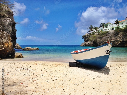 Bild auf Leinwand Strand mit Boot in der Karibik