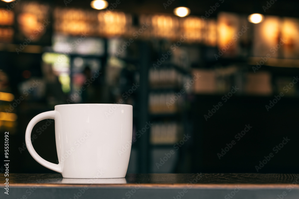 White Coffee Mug On Wooden Table In Cafe With Copyspace White Coffee Mug On Wooden Table In Cafe With Copyspace
