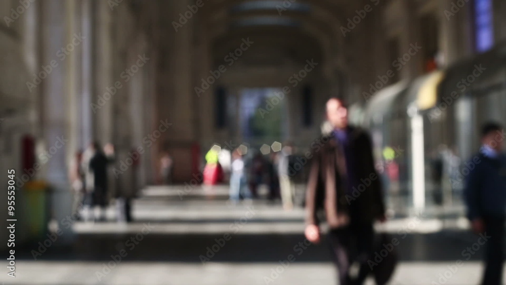 people with anonymous faces walking into the station in a out of focus background. big busy city people with anonymous faces walking into the station in a out of focus background. big busy city