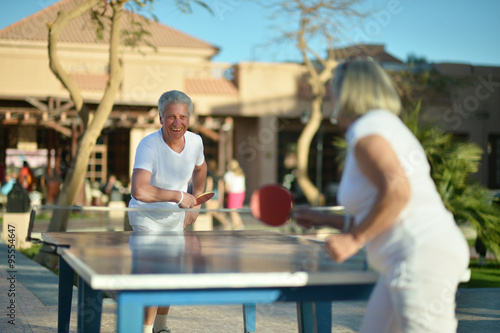 couple playing ping pong photo
