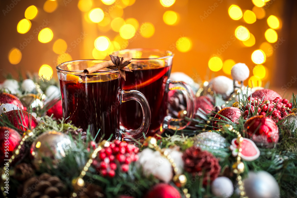 Christmas hot mulled wine with spices on a wooden table. The idea for creating greeting cards Christmas hot mulled wine with spices on a wooden table. The idea for creating greeting cards