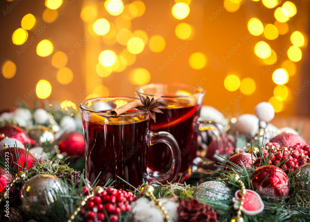Christmas hot mulled wine with spices on a wooden table. The idea for creating greeting cards Christmas hot mulled wine with spices on a wooden table. The idea for creating greeting cards