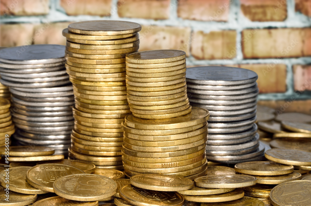 Folded stack of coins of yellow and white metal