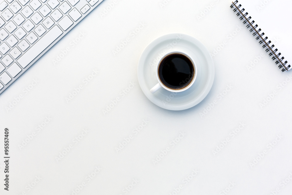 Office White Desk Top View with Business and Every Day Life Items Electronics and Coffee Mug Office White Desk Top View with Business and Every Day Life Items Electronics and Coffee Mug