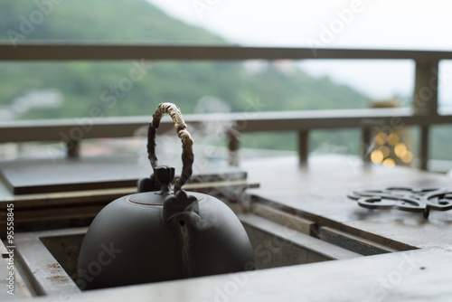Steaming kettle at traditional Chinese tea house © wooooooojpn