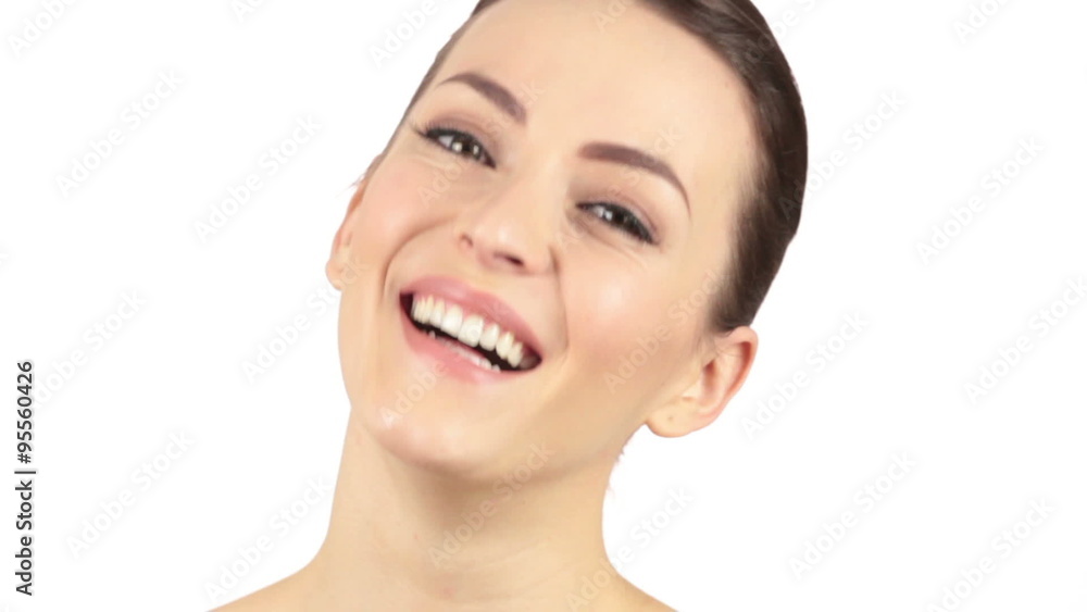 Attractive young woman looking around and laughing with her head back Attractive young woman looking around and laughing with her head back