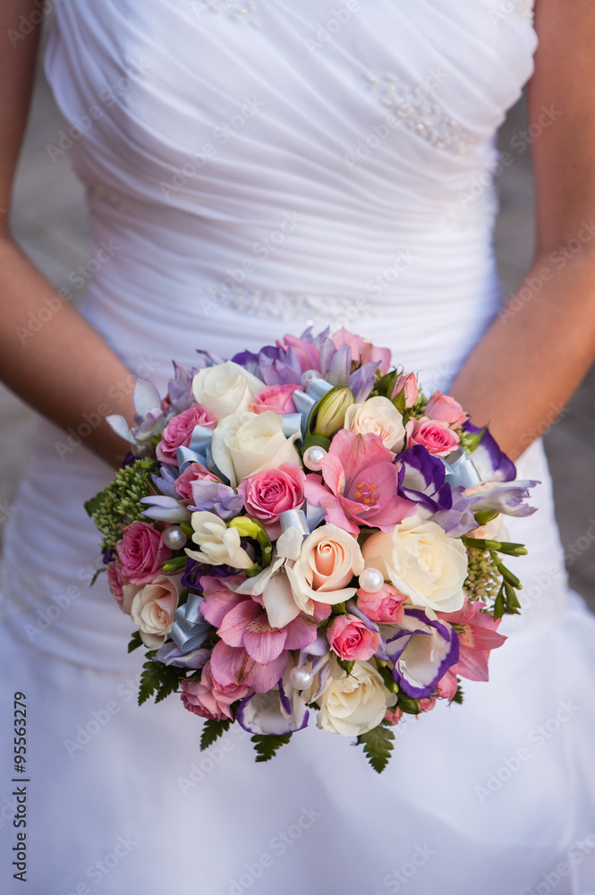Beautiful wedding a bouquet in hands of the bride Beautiful wedding a bouquet in hands of the bride