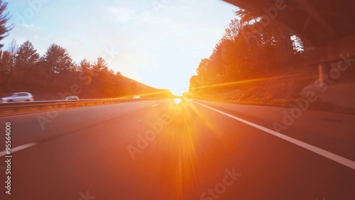 Autumn Point-of-view driving shot into Asheville, NC at sunset