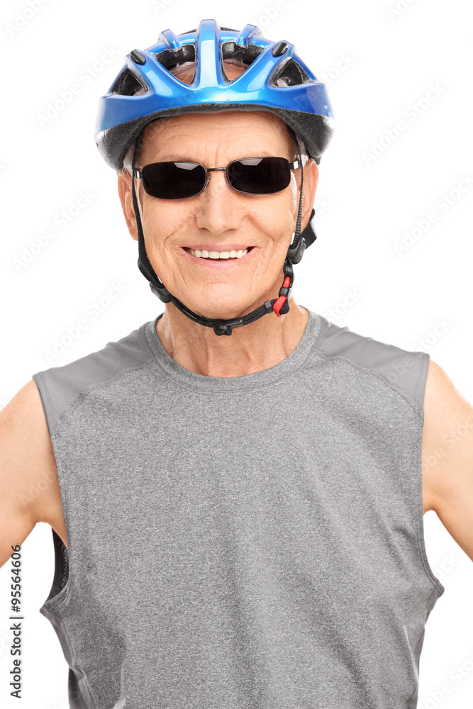 Senior biker posing with a blue helmet Senior biker posing with a blue helmet