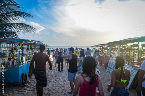 People walking on Jericoacoara beach during sunset photo