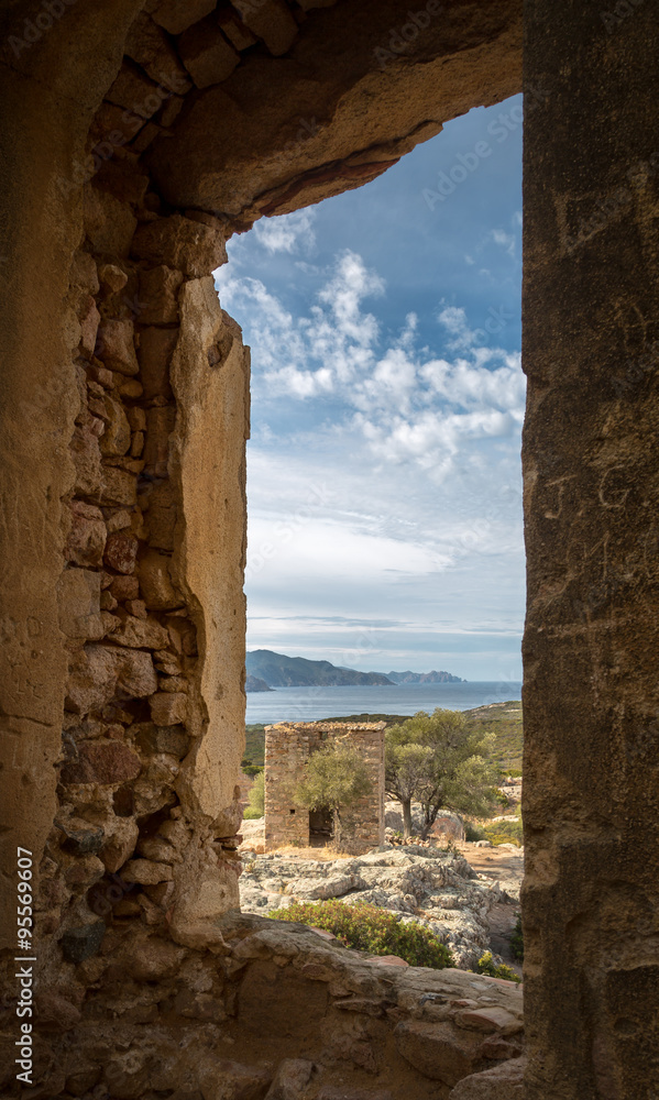 View of derelict building and coast near Galeria in Corsica