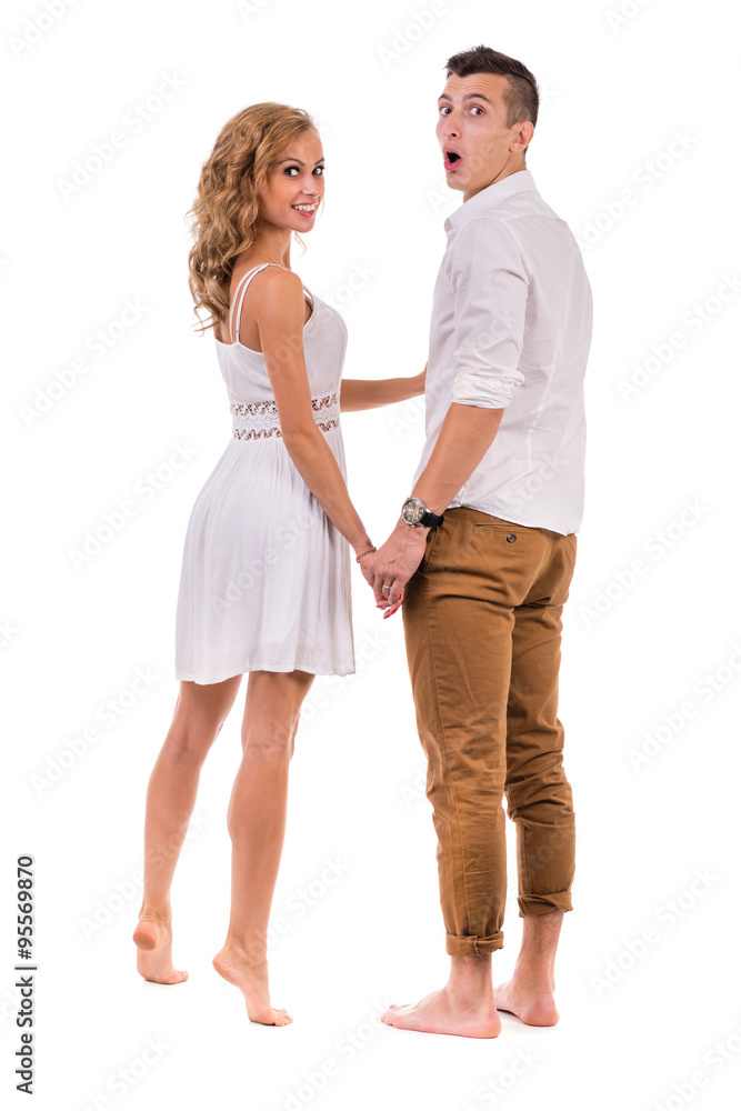 Surprised young couple on white background, isolated