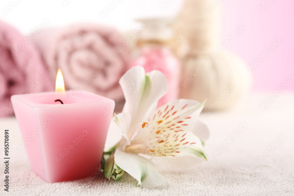 Spa treatment and flowers on wooden table, on light background Spa treatment and flowers on wooden table, on light background