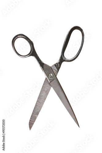 Photo of an old rusty scissors isolated on white background. Studio shot