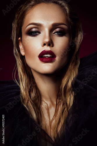 Close-up portrait of beautiful woman with bright make-up