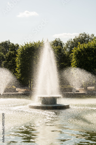 Wallpaper Mural Decorative fountain display creating water sprays in a pond. Torontodigital.ca