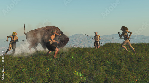 Group of neanderthal hunting a bison photo