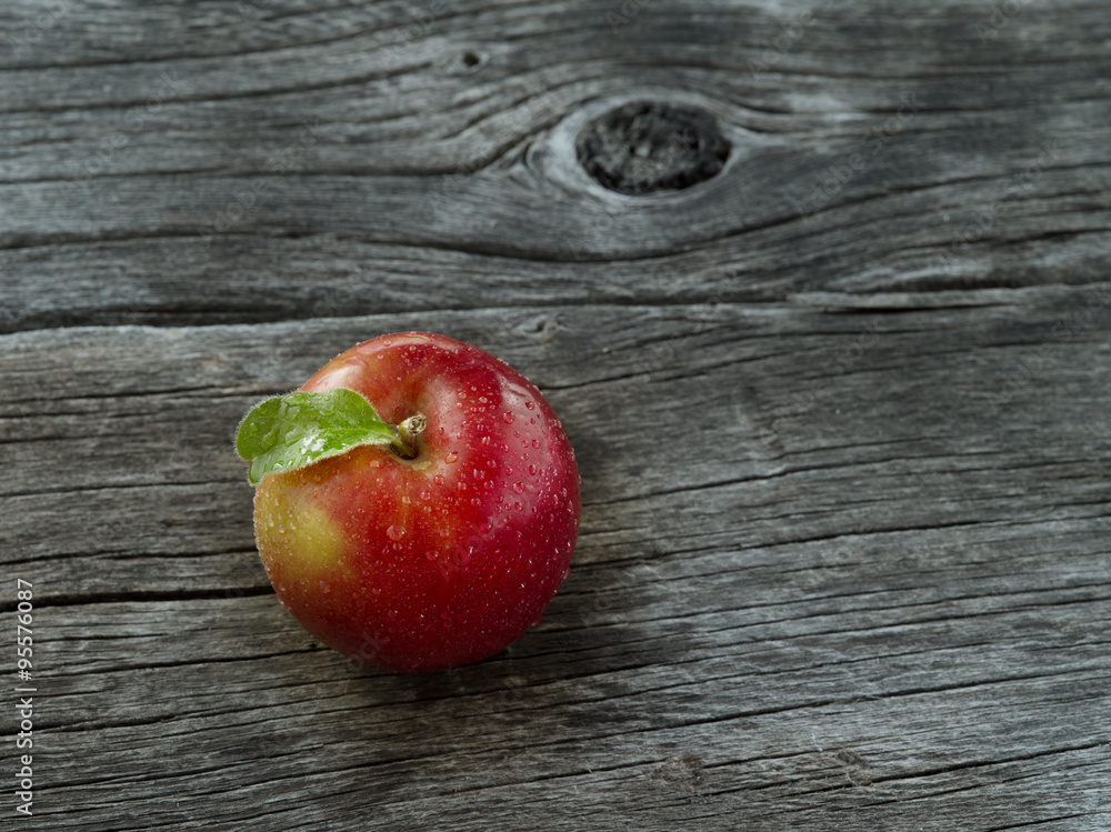 close up view of nice fresh apple on wooden background close up view of nice fresh apple on wooden background