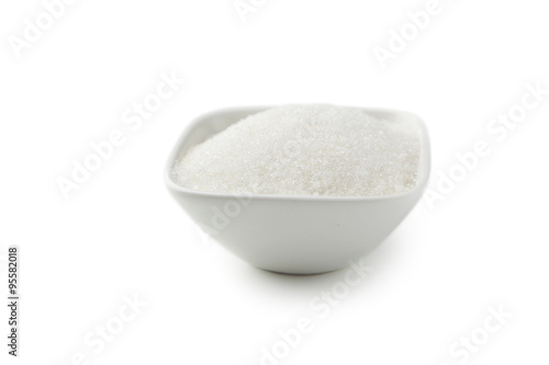 White sugar in bowl isolated on white