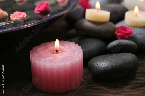 Spa composition of flowers, candles and stones, close-up
