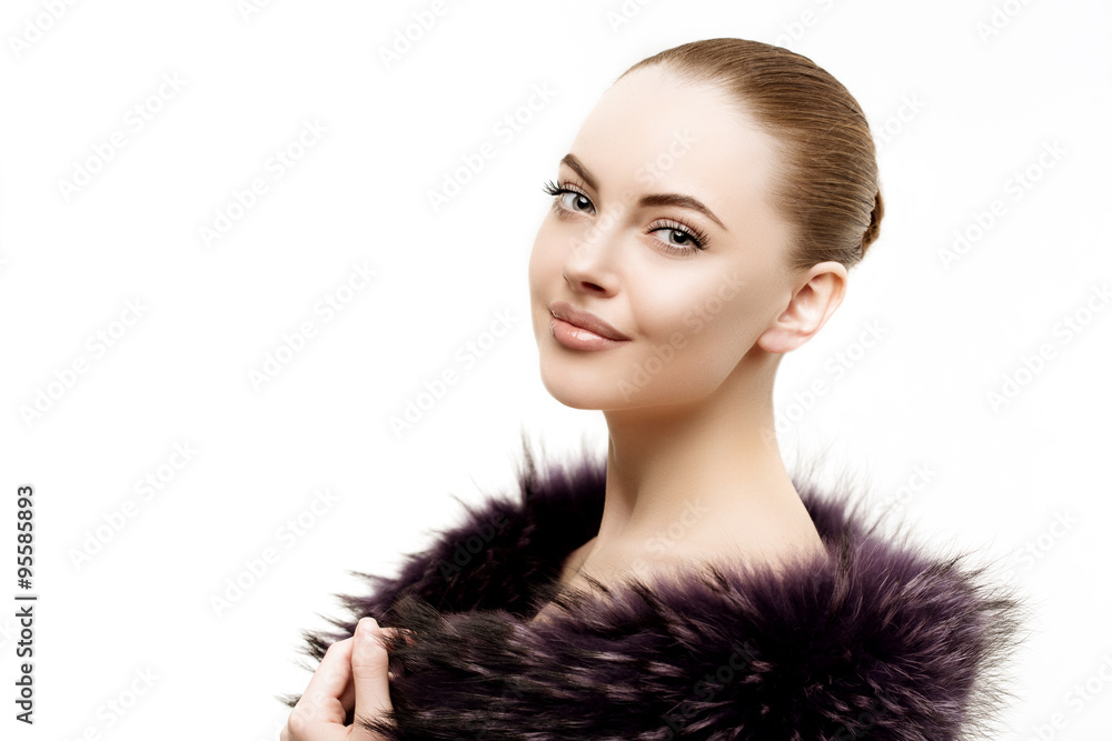 Woman in a fur coat. Young beautiful model in winter outerwear. Woman in a fur coat. Young beautiful model in winter outerwear.