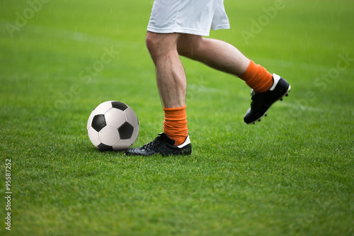 Fototapeta Naklejka Na Ścianę i Meble -  Running soccer player. Soccer football wallpaper