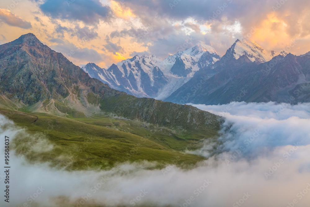 Sunset over cloudy walley at Caucasus mountains Sunset over cloudy walley at Caucasus mountains