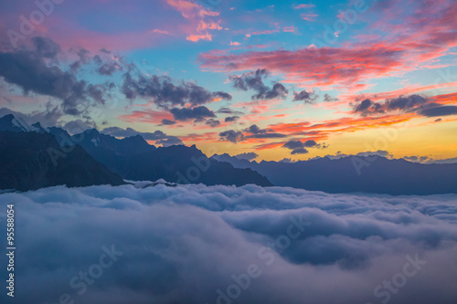 Sunset over cloudy walley at Caucasus mountains © Viktar Malyshchyts