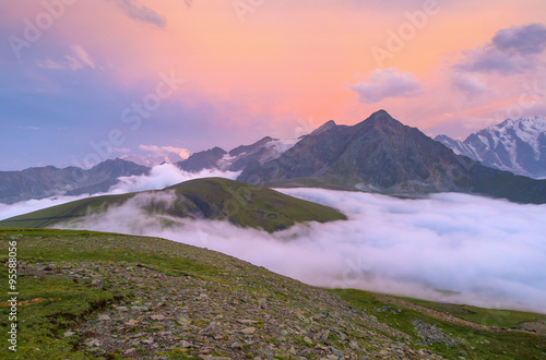 Sunset over cloudy walley at Caucasus mountains