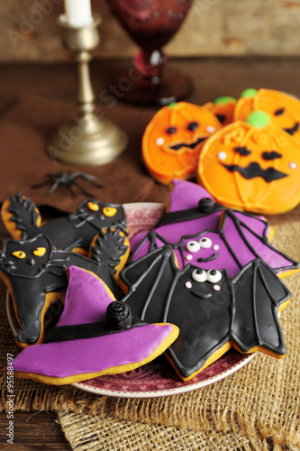 Creative Halloween cookies on wooden background