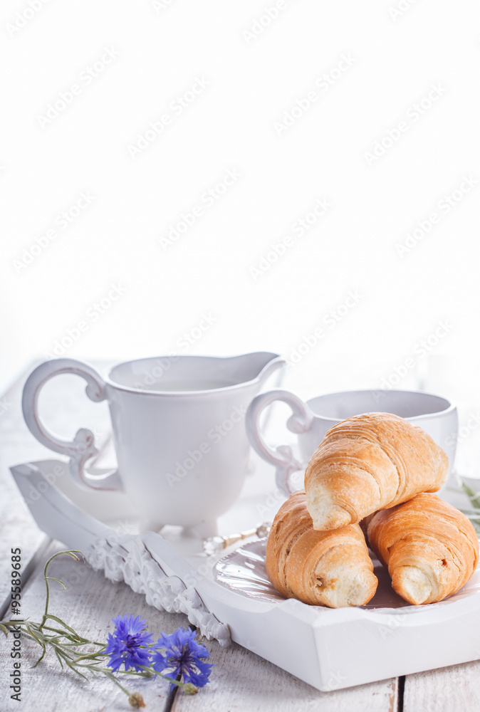 Croissants,coffee, milk on a tray,Breakfast. selective focus. Croissants,coffee, milk on a tray,Breakfast. selective focus.